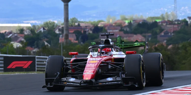 Ferrari’s Charles Leclerc leads Red Bull’s Max Verstappen before suffering mechanical problem